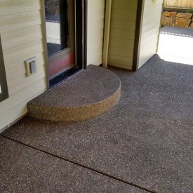 exposed concrete patio and step