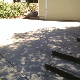 concrete driveway with stairs